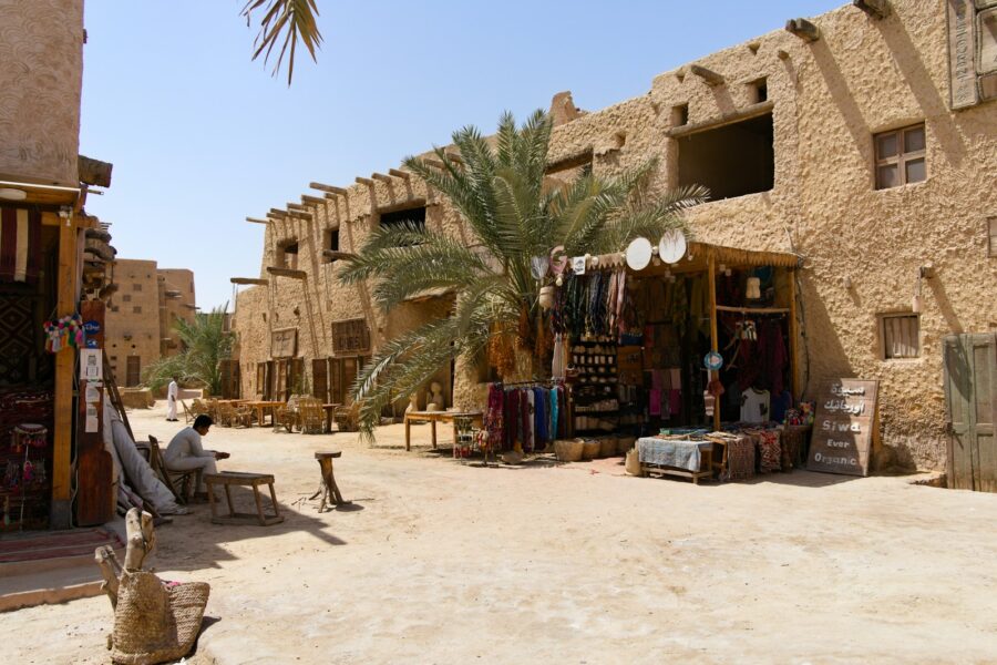 Egyptian desert city ruins sandstone sunlight