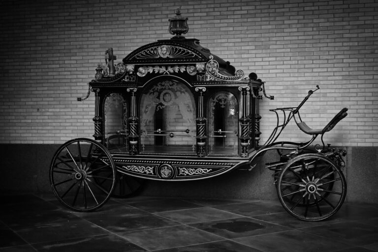 Victorian funeral procession horse-drawn hearse cemetery