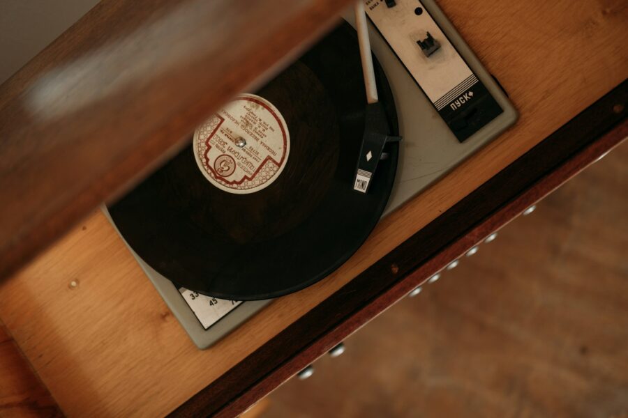 Vinyl records stack turntable wooden table