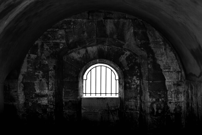Stone prison cell dark interior