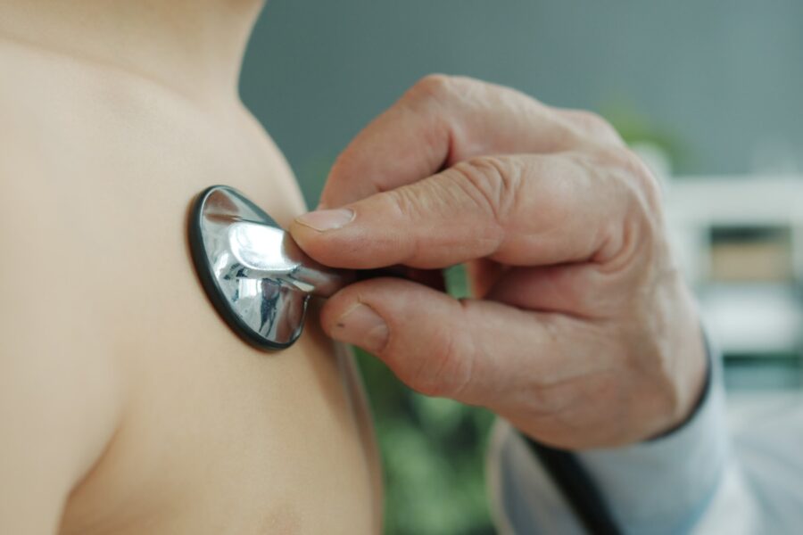 Doctor using stethoscope