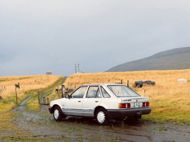 Vintage car stuck mud rural road